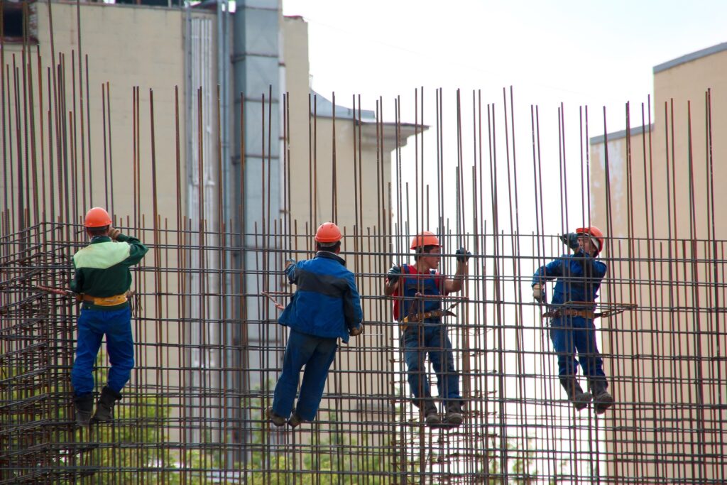 Construction steel workers on scaffolding